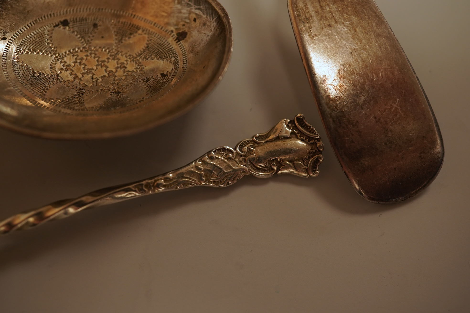 A small quantity of 18th century and later assorted silver teaspoons, various patterns, dates and makers, together with a George V silver pastry fork and two George V silver caddy spoons, 10.7oz.